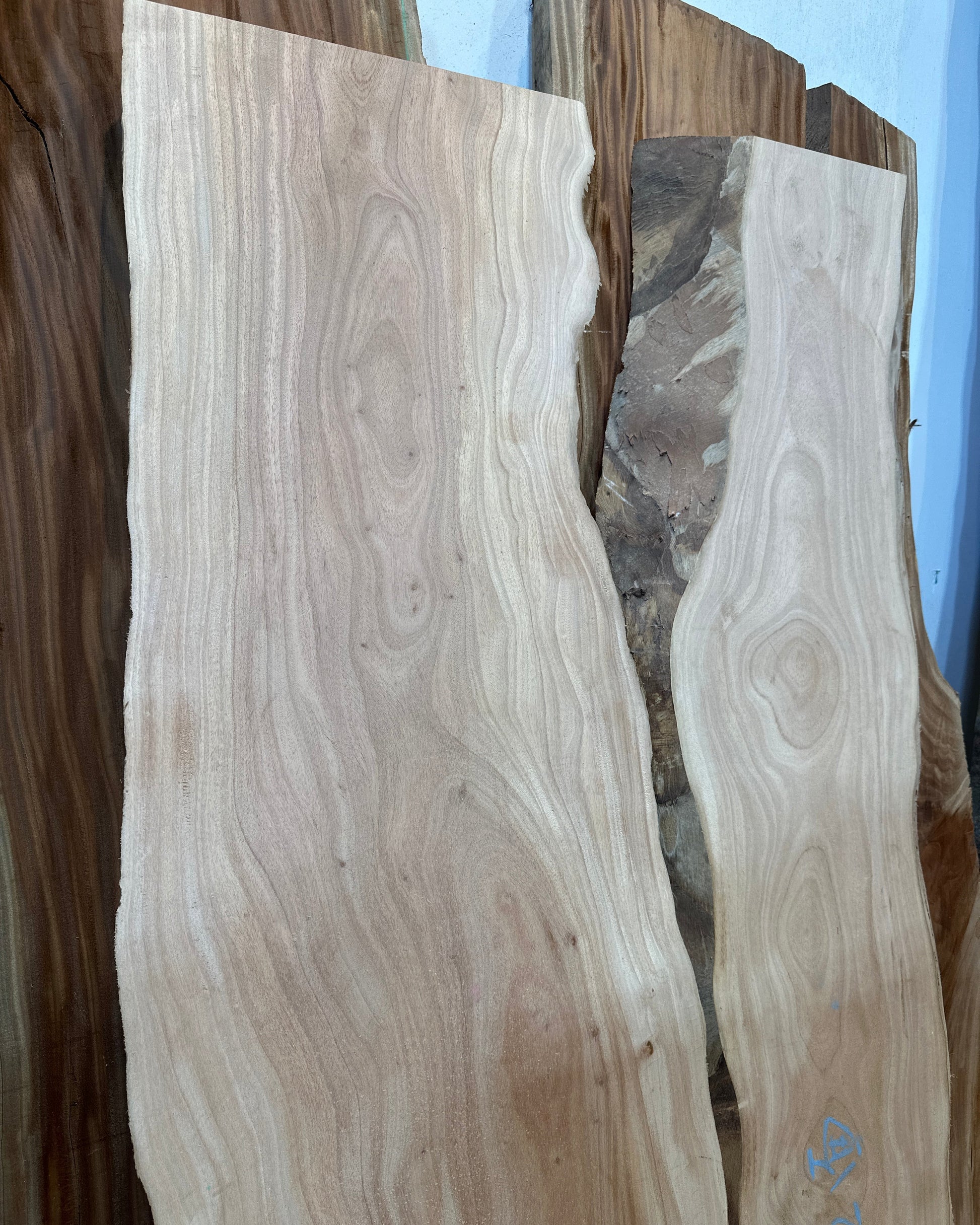 Signature African Mahogany premium live edge wood slab with distinctive natural grain
