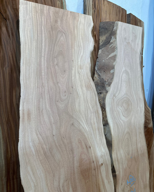 Signature African Mahogany premium live edge wood slab with distinctive natural grain
