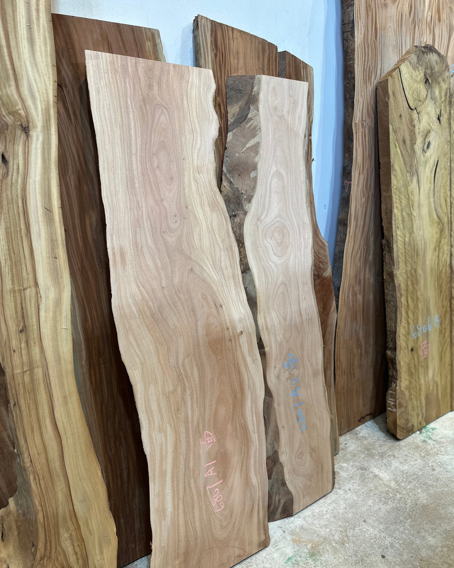 Signature African Mahogany premium live edge wood slab with distinctive natural grain
